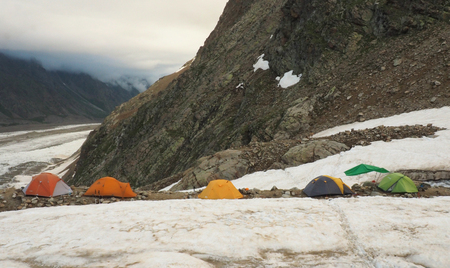 tourist camp in the mountains on glacierの写真素材