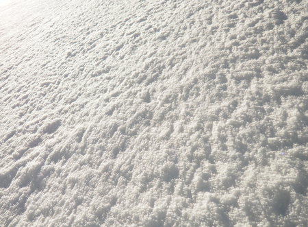 background of fresh snow texture in blue toneの写真素材