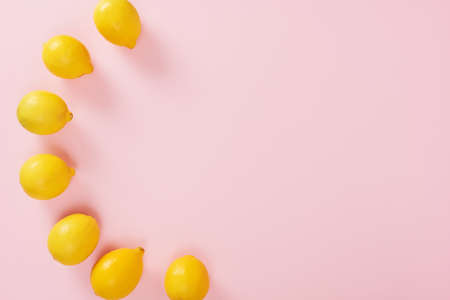 Lemons isolated on pink background. High Angle View Of Lemons. Free space for text.の写真素材