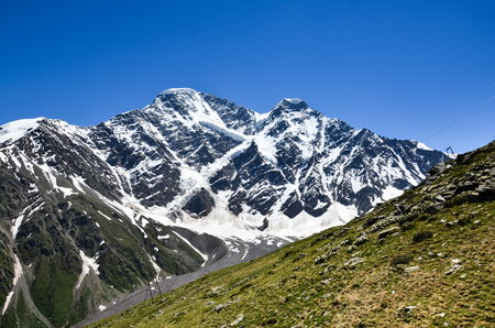 A beautiful mountain landscape. View of the Donguz-Orun mountain from Mount Cheget. Russia.の写真素材