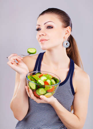 happy healthy woman with saladの写真素材