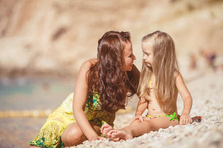 Happy family resting at beach in summerの写真素材