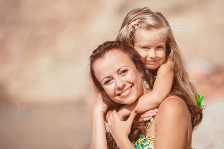 Happy family resting at beach in summerの写真素材