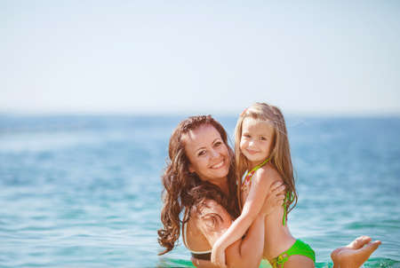 Happy family resting at beach in summerの写真素材