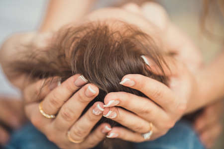 baby s head in my mother s hands