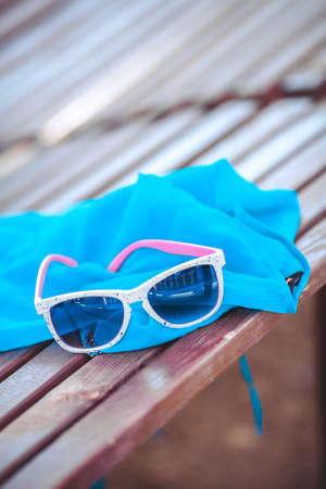 fashion hipster sunglasses lying on sun loungerの写真素材