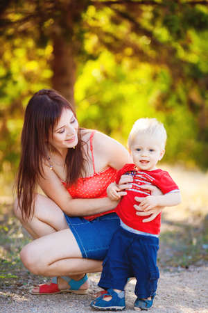 Young mother with child outside on a summer dayの写真素材