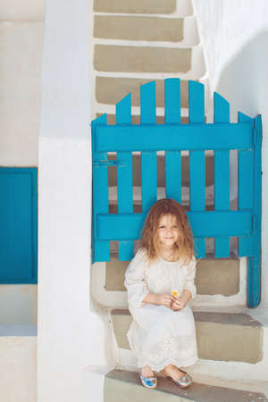 Very cute little princess outdoors in city streetの写真素材