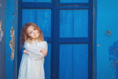 Very cute little princess outdoors in city streetの写真素材