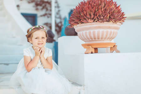 Very cute little princess outdoors in city streetの写真素材