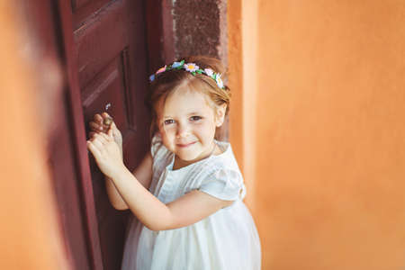 Very cute little princess outdoors in city streetの写真素材