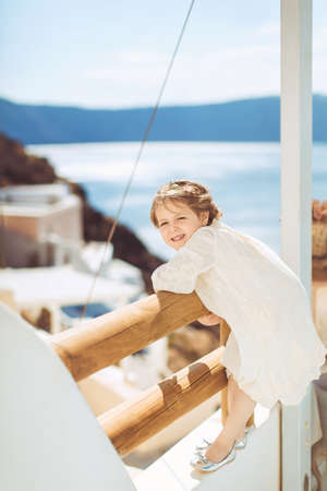 Very cute little princess outdoors in city streetの写真素材