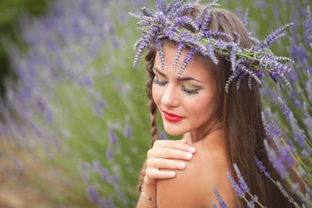 Beautiful provence woman relaxing in lavender field watching on sunset holding basket with lavanda flowers  Series  alluring girl with purple lavender  blond lady in blossom field   Ukraine - Crimeaの写真素材