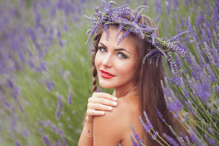 Beautiful provence woman relaxing in lavender field watching on sunset holding basket with lavanda flowers  Series  alluring girl with purple lavender  blond lady in blossom field   Ukraine - Crimeaの写真素材