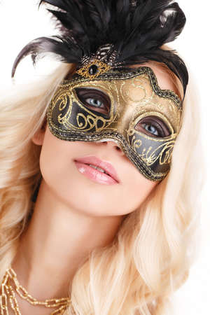 near the portrait of a beautiful blonde with Venetian mask on white backgroundの写真素材