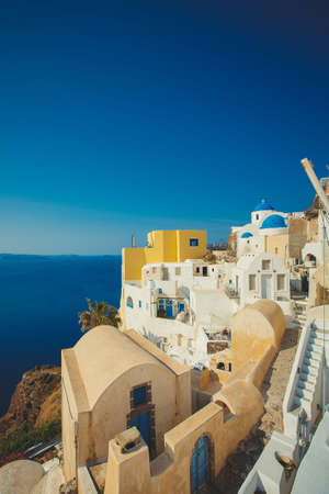 View to the sea and Volcano from Fira the capital of Santorini island in Greeceの写真素材