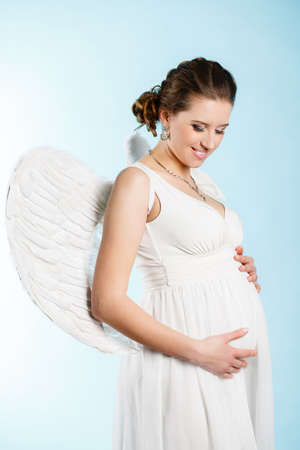 Portrait of a beautiful angelic pregnant woman  Angelの写真素材