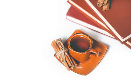 Cup of Hot tea with cinnamon sticks, lemon and star aniseの写真素材