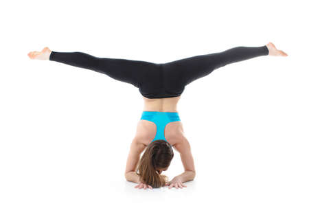 portrait of Young woman doing yoga exercise in white studio  Straightching  Series