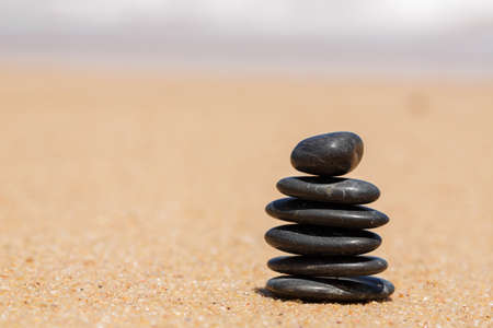 Zen stones jy on the sandy beach near the sea  Outdoor 