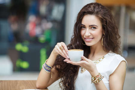 Woman drinking coffee at homeの写真素材
