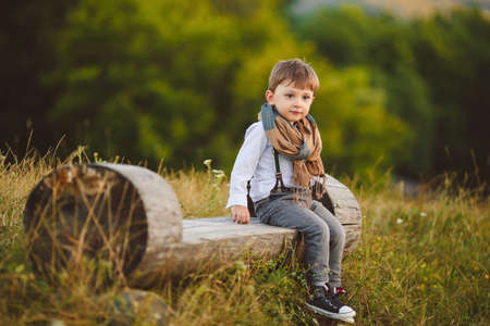 stylish baby boy having fun outside in the park  Cute happy boy child outdoorsの写真素材