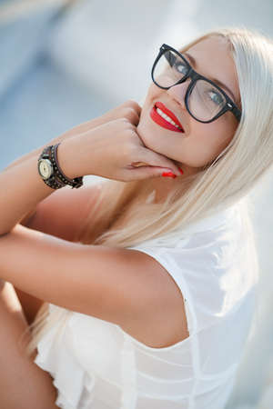 Young beautiful tender woman in sunglasses. Lovely sensual girl fashion outdoor portrait.の写真素材