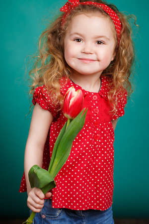 Studio Portrait Of A Pretty Little Girl Child With Long Curly Hair