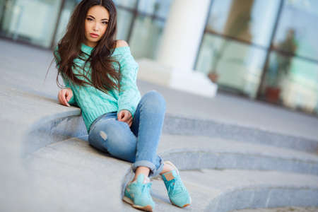 Portrait Of Young Smiling Beautiful Woman. Pretty Woman Smiling. Woman outdoor in the city.の写真素材