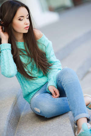 Portrait Of Young Smiling Beautiful Woman. Pretty Woman Smiling. Woman outdoor in the city.の写真素材