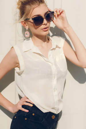Portrait of young pretty woman in summer.Stylish beautiful womanblond model in dark...