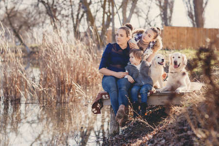 Three sisters, beautiful girls, brunettes, hair pulled back, spend time together with their beloved...