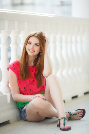 Young beautiful woman with long straight, straight hair and green eyes, beautiful make-up, pink...