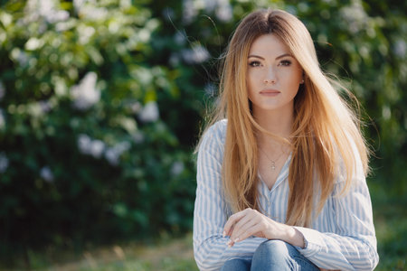 A slender, tall, beautiful woman, model appearance, long straight red hair, green eyes, dressed in a...