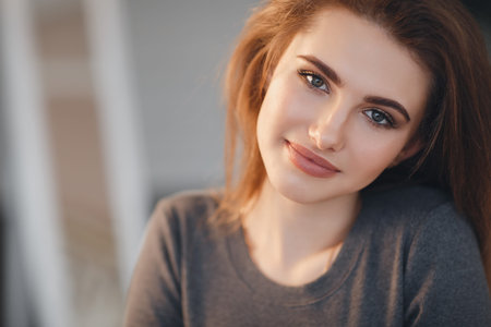 Beautiful sexy girl in an elegant gray sweater. Close-up