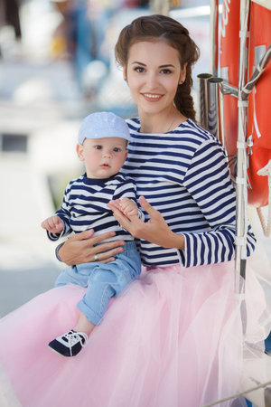 A girl is wearing a pair of red hair vestの写真素材