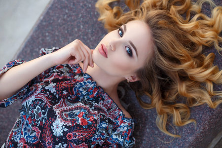 Beautiful girl with red hair and light hair