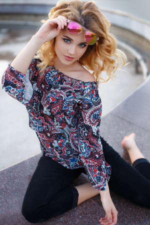 Beautiful girl with red hair and light hairの写真素材