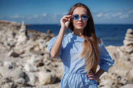 He was wearing a pair of sun glasses, posing for a photographerの写真素材