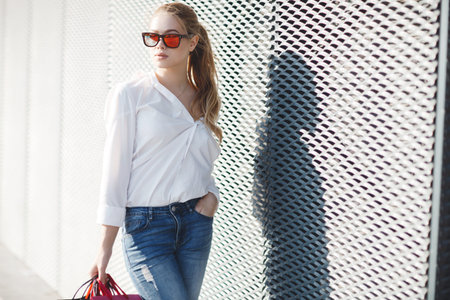 Black Friday and Boxing Day. Shopping gift and present on holiday. Beautiful women holding a...