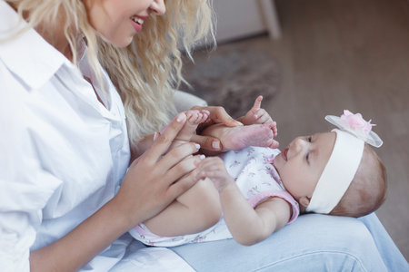 Mother and Baby smiling together. Love Mom and baby girl Beautiful healthy mother and little...