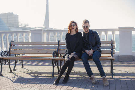 It is a beautiful sunny city. Happy couple is expecting a baby. The concept of love and family well-beingの写真素材