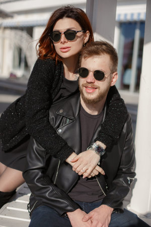 It is a beautiful sunny city. Happy couple is expecting a baby. The concept of love and family well-beingの写真素材