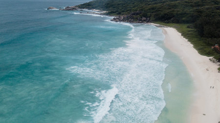 Aerial shot from drone. Top view on the rocky ocean shore. Volcanic beach of Tropical Island Oahu...