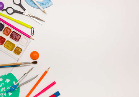 School mockup. Office supplies on a white background, free space for text.の写真素材