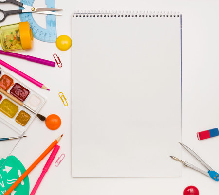 Background for school and student design. A sketchbook in the center and stationery. Copyspace
