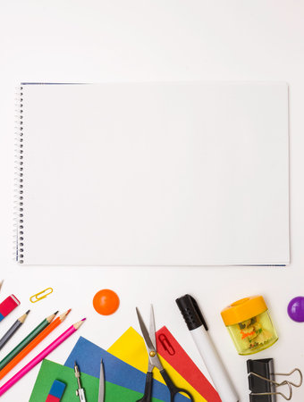 Background for school and student design. A sketchbook in the center and stationery. Copyspaceの写真素材