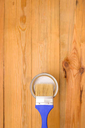 Tools for construction and decoration. Painting. A paintbrush and a metal can of paint. Wooden...