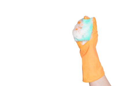 Hand in an orange rubber glove with an blue sponge and foam on a white background. Washing dishes,...