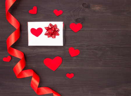 Gift with satin ribbon and heartsの写真素材